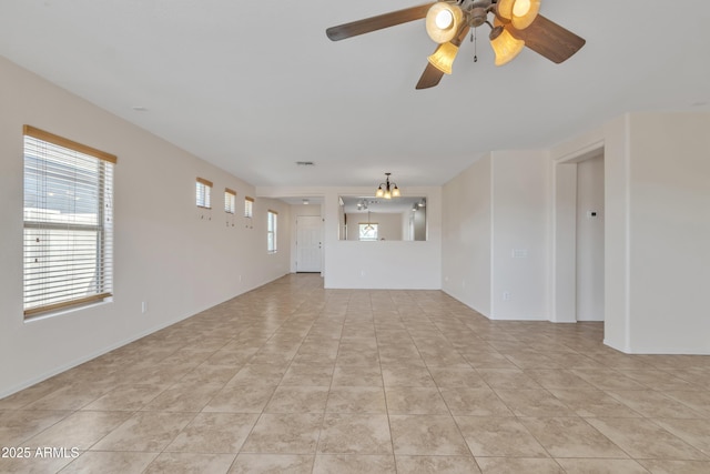 unfurnished living room with light tile patterned floors and a ceiling fan
