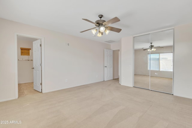 unfurnished bedroom featuring visible vents, a ceiling fan, connected bathroom, and light carpet