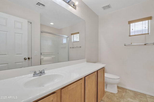 bathroom featuring visible vents, toilet, a shower stall, and a healthy amount of sunlight