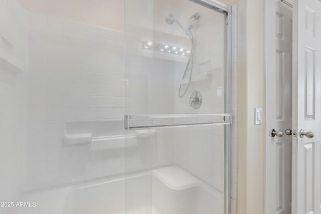 bathroom with a tile shower