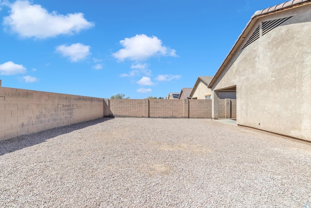 view of yard featuring a fenced backyard and a patio