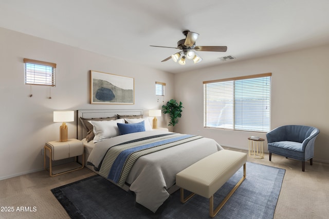 carpeted bedroom with baseboards, a ceiling fan, and visible vents