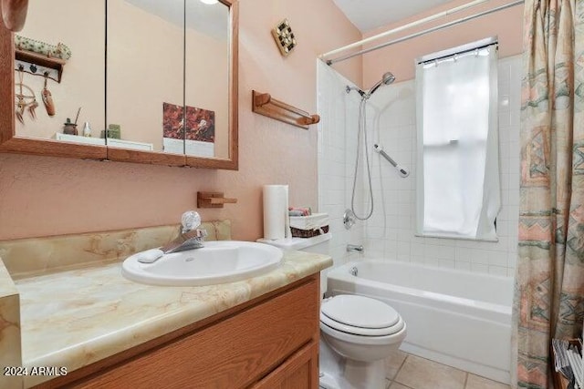 full bathroom with tile patterned floors, shower / tub combo with curtain, vanity, and toilet