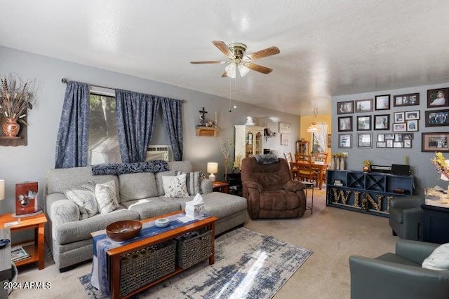 carpeted living room with a textured ceiling and ceiling fan