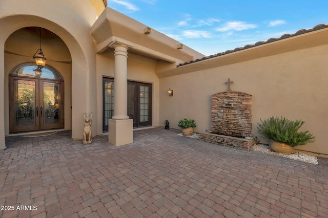 doorway to property with a patio and french doors