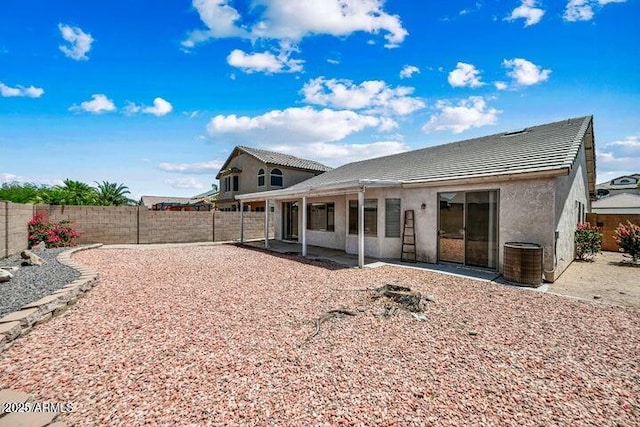 back of house with a patio area and cooling unit