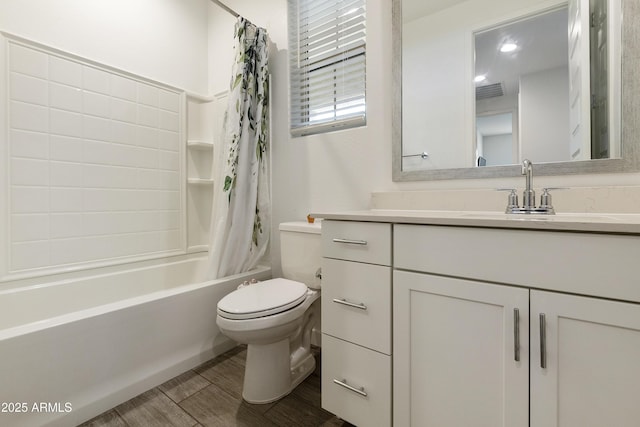 bathroom with shower / bath combo with shower curtain, toilet, visible vents, vanity, and wood finished floors