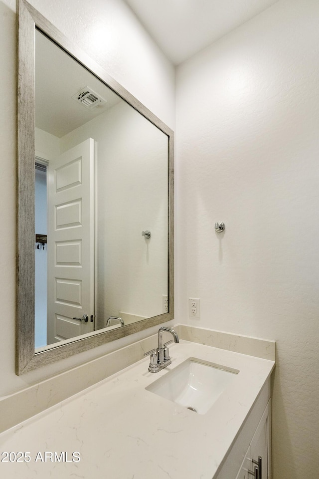 bathroom featuring visible vents and vanity