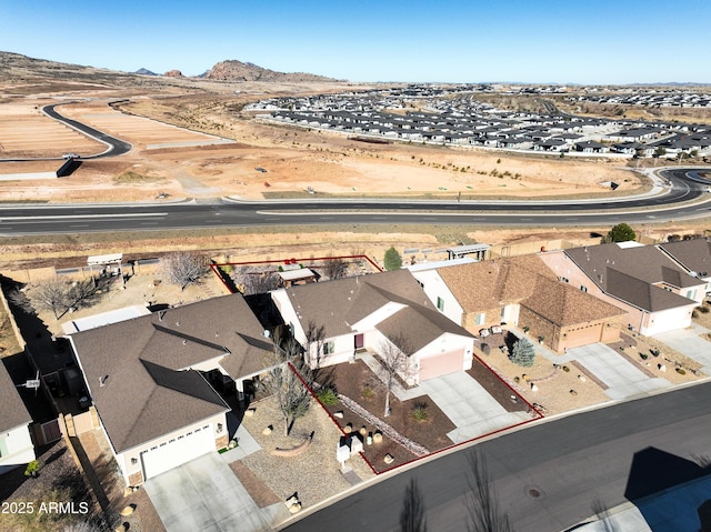 drone / aerial view with a residential view and a mountain view