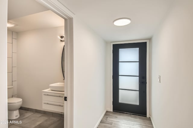 doorway with light hardwood / wood-style flooring