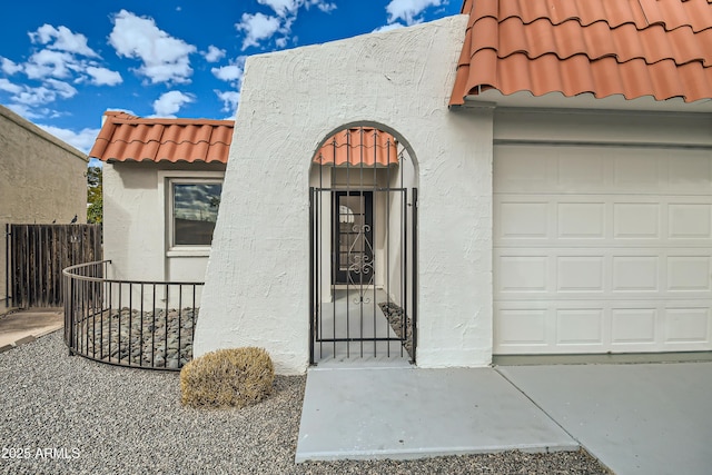 entrance to property featuring a garage