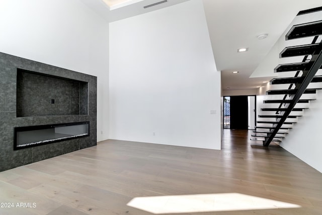 unfurnished living room with hardwood / wood-style floors