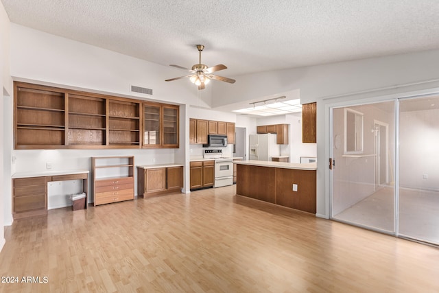 kitchen featuring built in desk, light hardwood / wood-style floors, white appliances, and ceiling fan