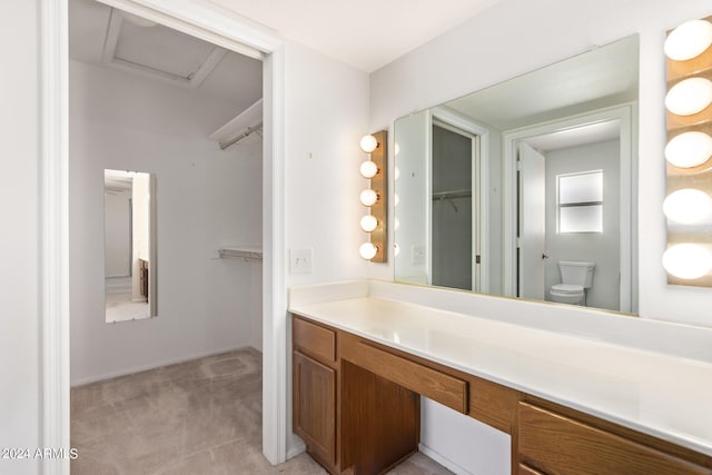 bathroom featuring vanity and toilet