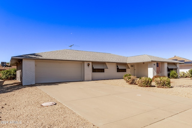 single story home featuring a garage