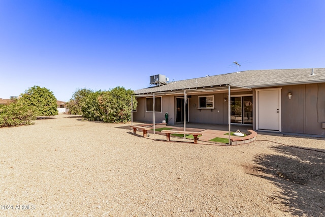 back of house featuring central air condition unit and a patio area