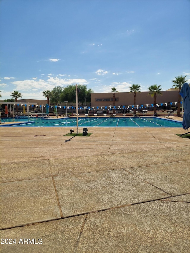 view of swimming pool with a patio area