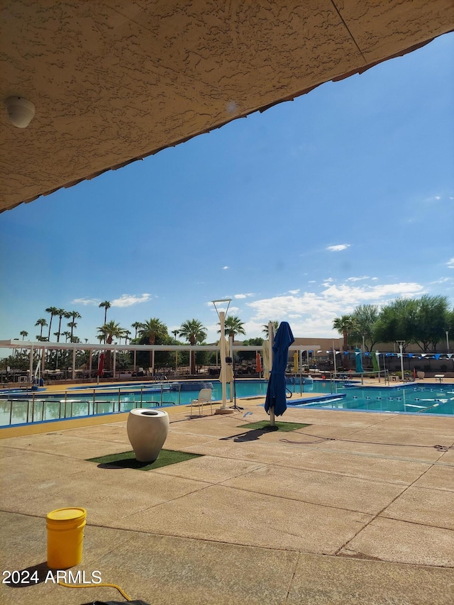 view of swimming pool with a patio area