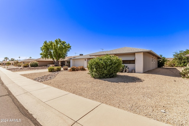 single story home with a garage