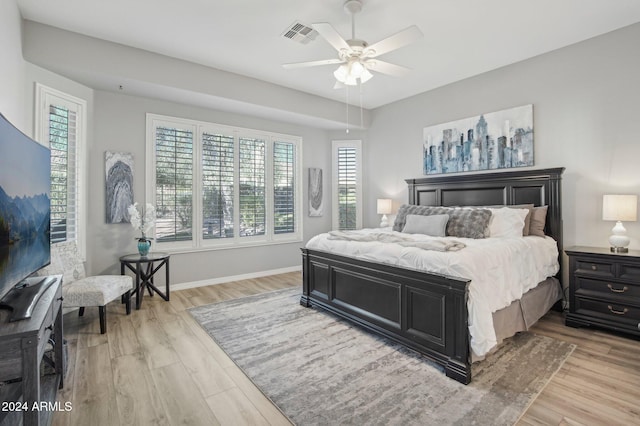 bedroom featuring ceiling fan and light hardwood / wood-style flooring