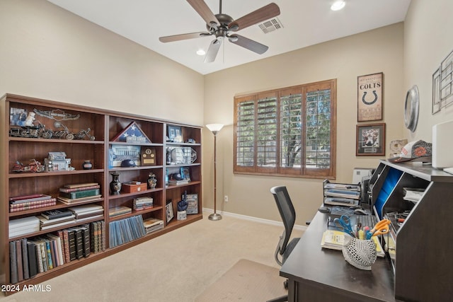 carpeted office featuring ceiling fan