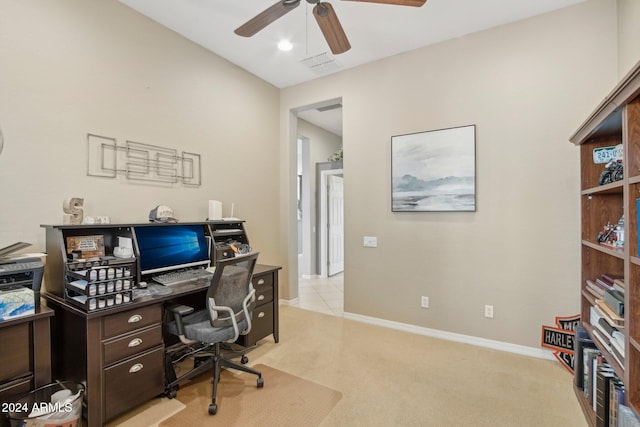 carpeted office featuring ceiling fan