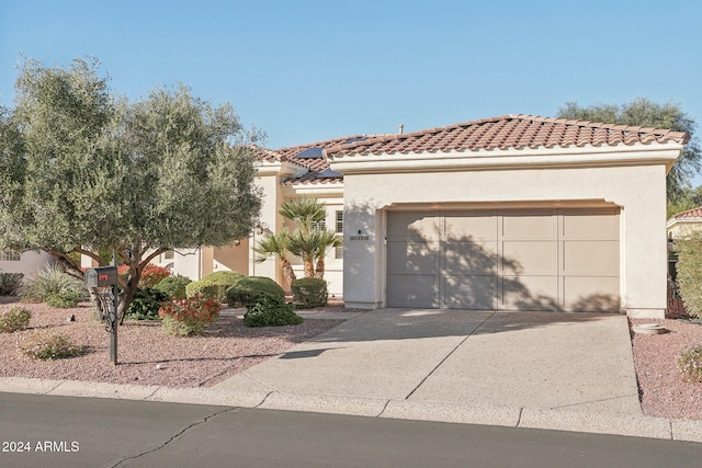 view of front of property with a garage