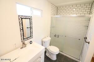 bathroom with toilet and vanity