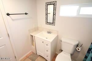 bathroom with toilet and vanity