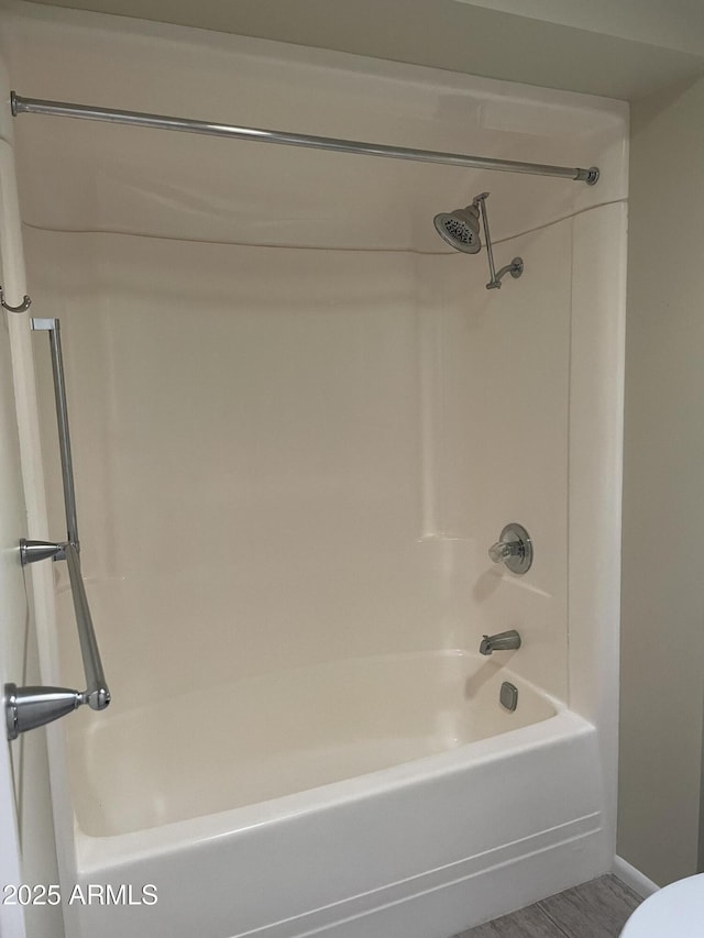 full bathroom with shower / washtub combination