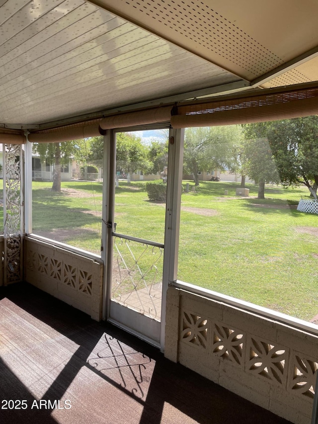 unfurnished sunroom featuring wooden ceiling