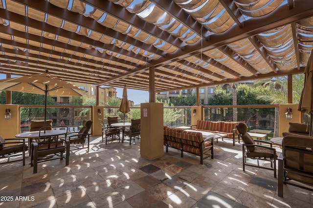 view of patio featuring outdoor dining area, an outdoor hangout area, and a pergola