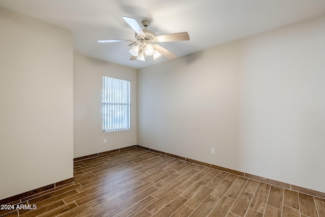 unfurnished room with ceiling fan and wood-type flooring