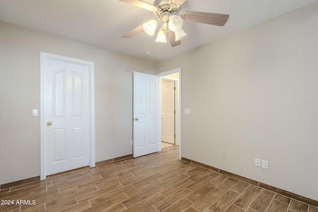 unfurnished bedroom featuring ceiling fan