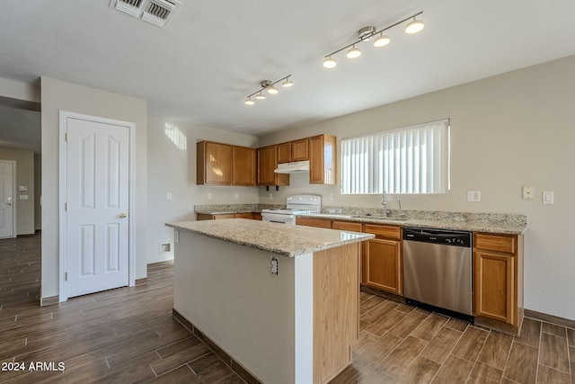 kitchen with a center island, sink, dark wood-type flooring, stainless steel dishwasher, and white stove