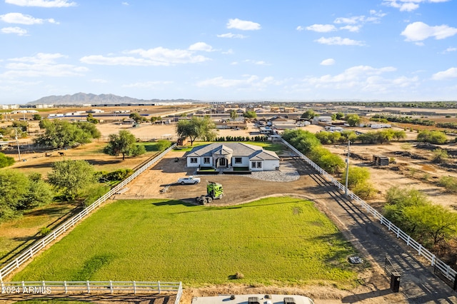 birds eye view of property with a mountain view and a rural view