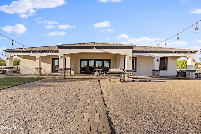 17617 W Rose Ln, Waddell, AZ 85355 - rear view of property featuring stucco siding and a patio area