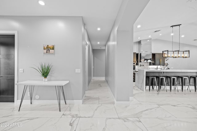 17617 W Rose Ln, Waddell, AZ 85355 - corridor featuring recessed lighting, marble finish floor, a sink, and baseboards
