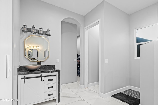 17617 W Rose Ln, Waddell, AZ 85355 - bathroom featuring vanity, marble finish floor, and baseboards