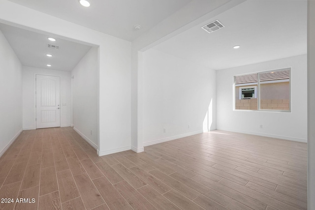 empty room with light wood-type flooring