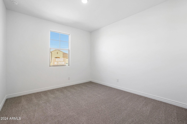 unfurnished room featuring carpet