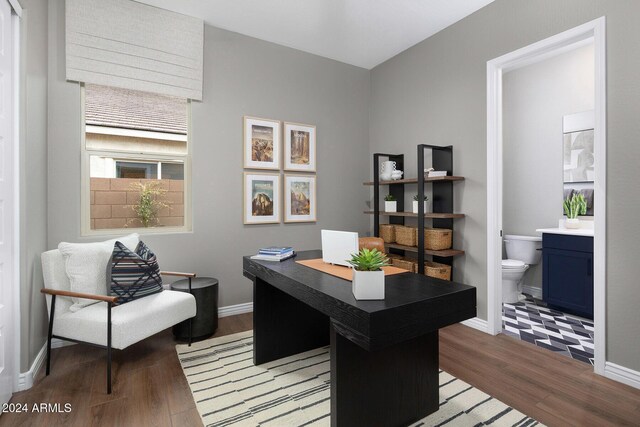 home office with dark wood-type flooring