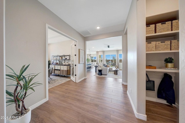 corridor featuring hardwood / wood-style floors