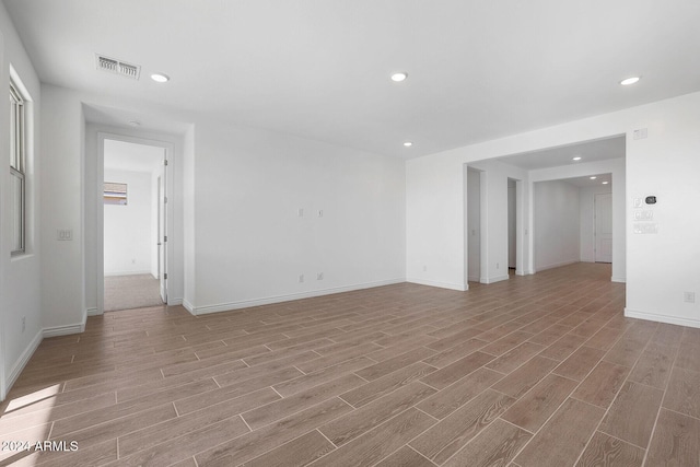 spare room featuring light wood-type flooring