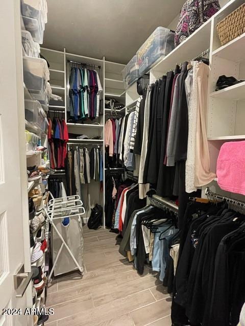 walk in closet featuring light hardwood / wood-style floors