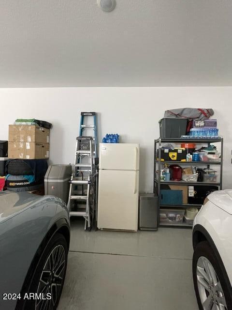 garage with white fridge