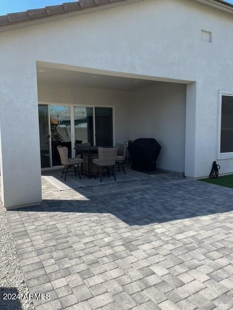 rear view of property featuring a patio area