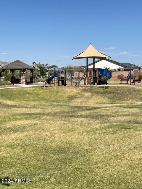 view of home's community featuring a lawn, a gazebo, and a playground