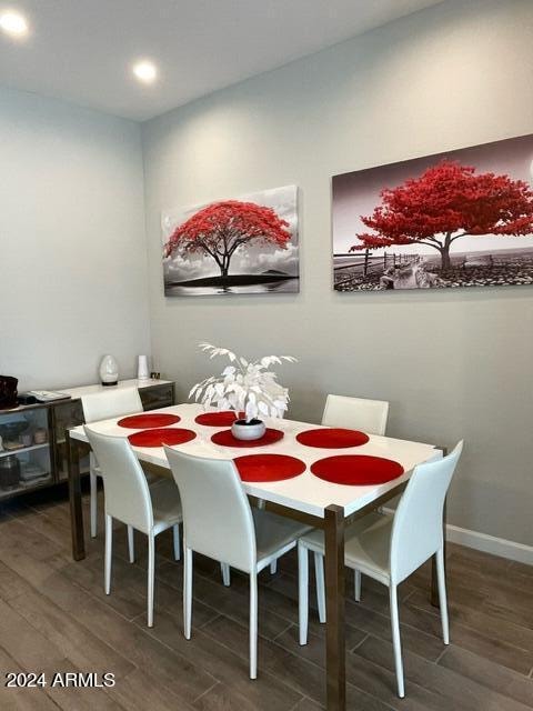 dining area with dark hardwood / wood-style flooring