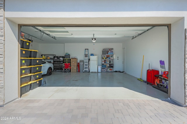 garage featuring white refrigerator